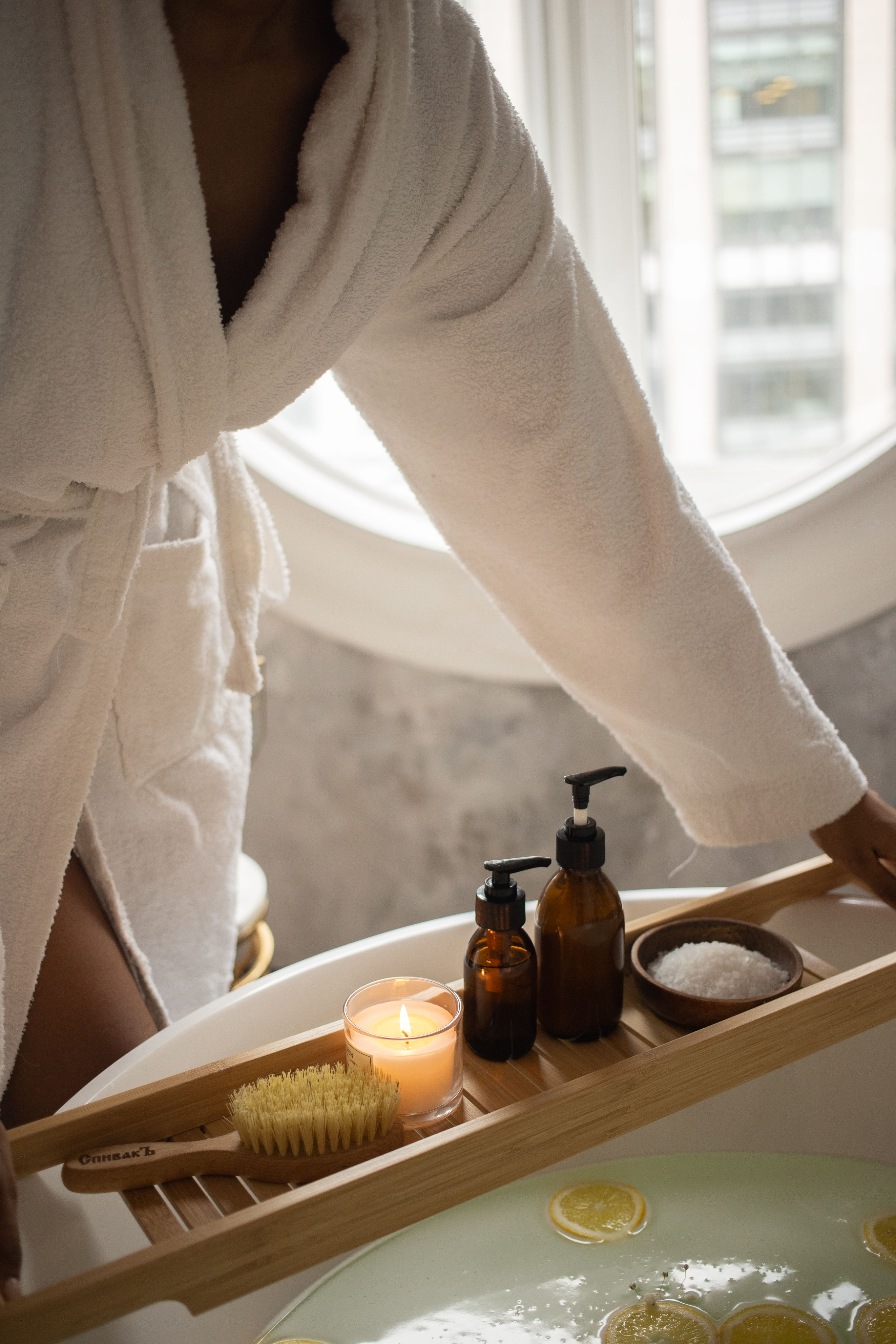 Warm bath tray with skincare and candles